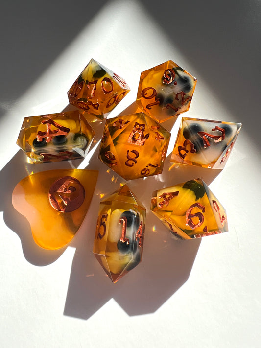 Creamy orange resin dice with plastic spheres inside to mimic boba tea.